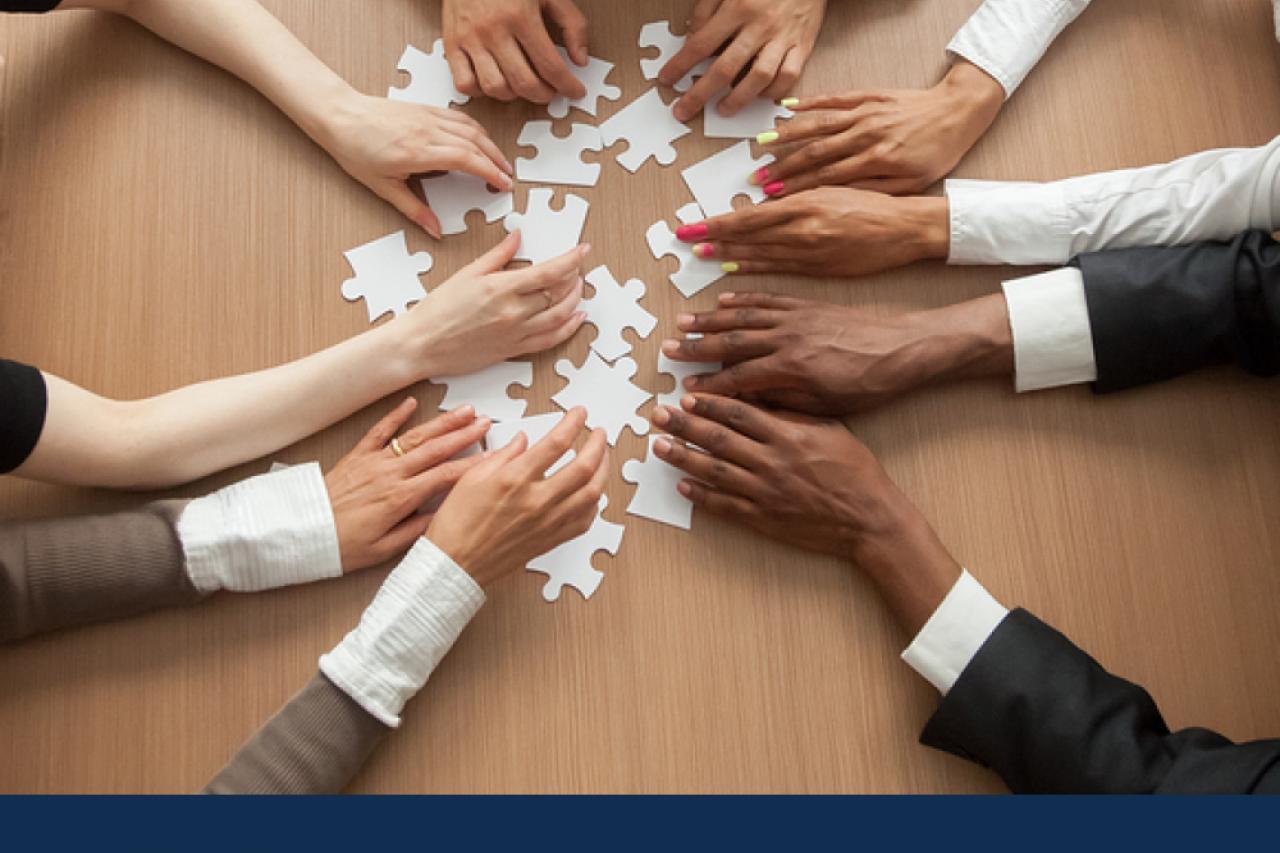 2020 Census people's hands solving a puzzle