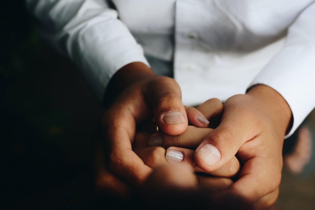 doctor holding patient's hand