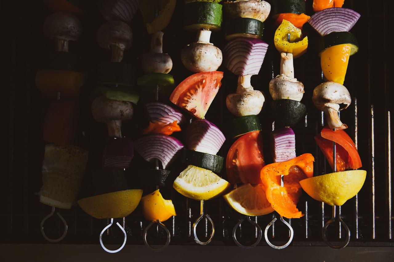 skewered vegetables on a grill