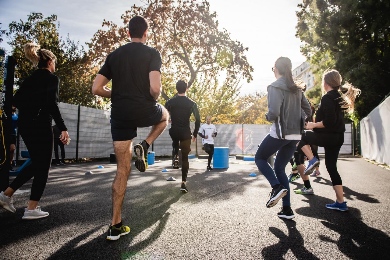 a group of people wearing black jog in place