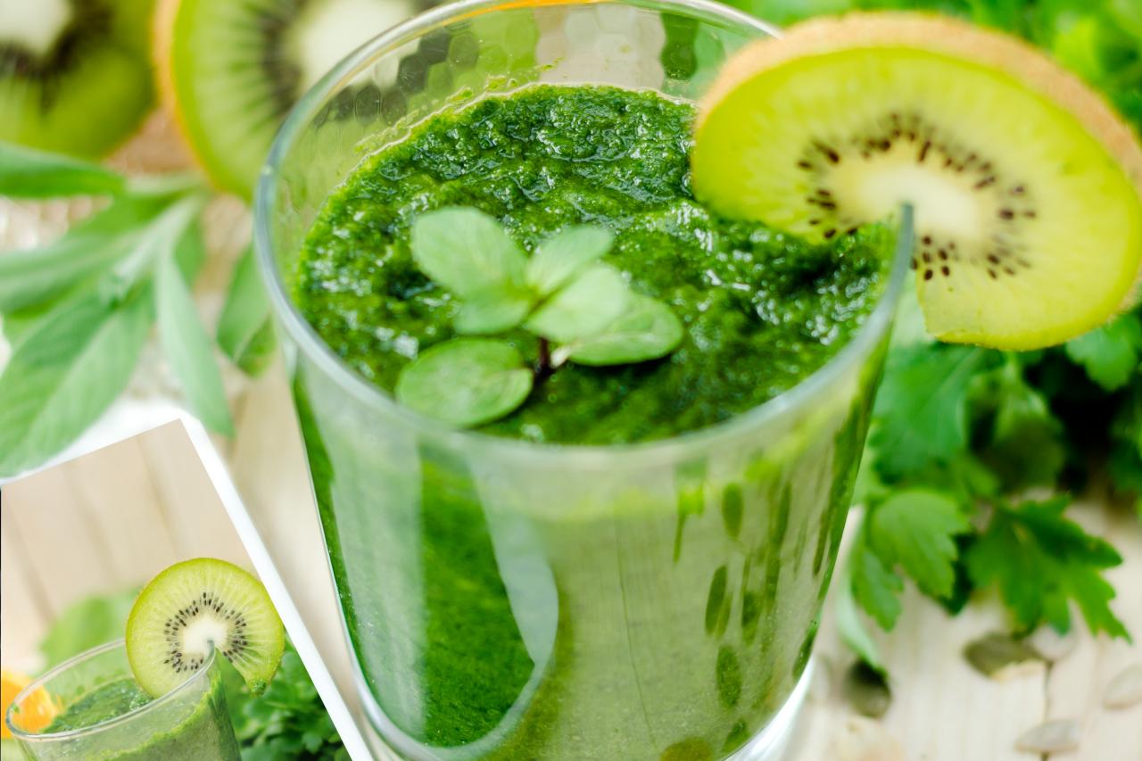 a picture of a green smoothie consisting of kiwi; parsley; mint; and orange