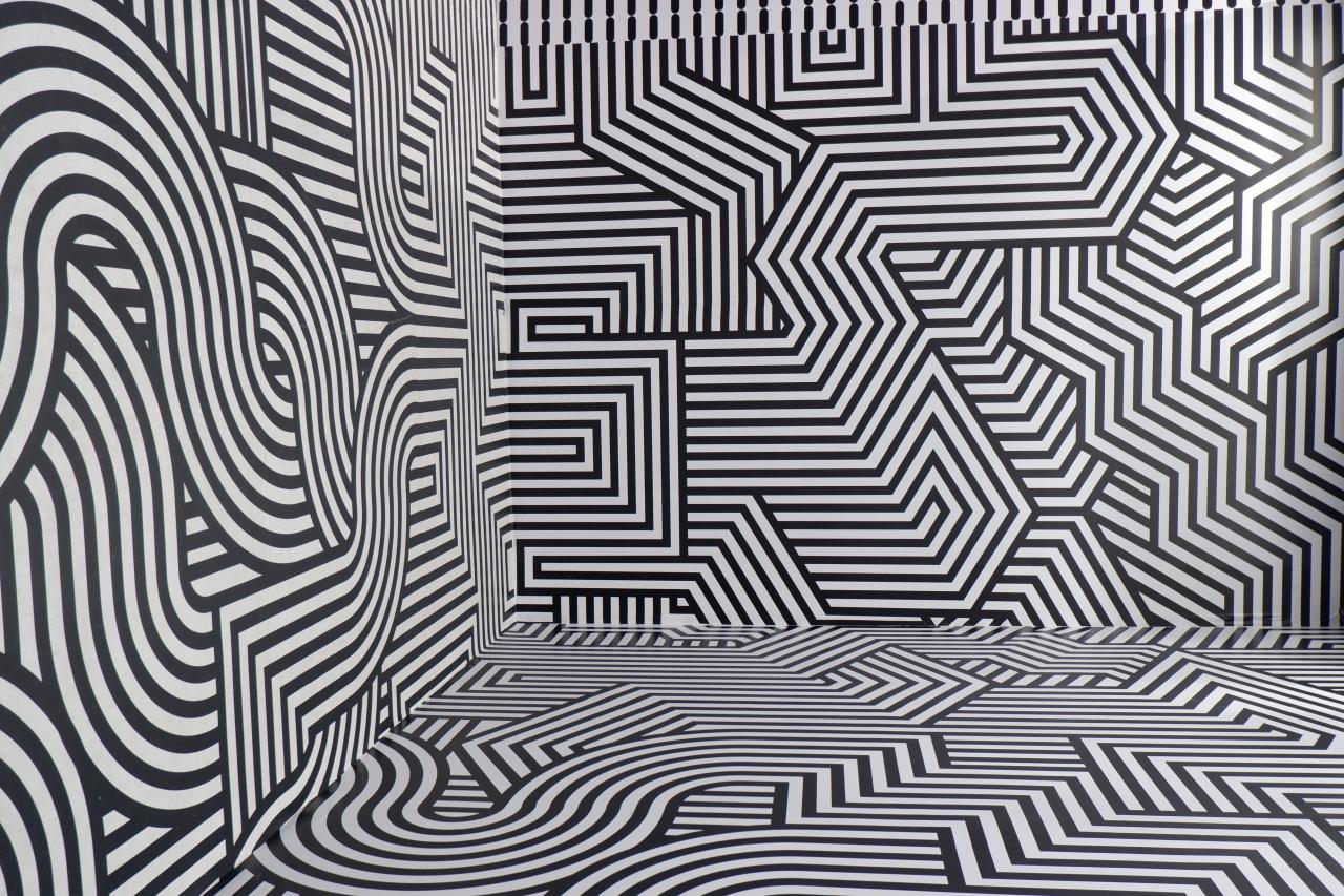 a room covered in zigzag and swirly patterns
