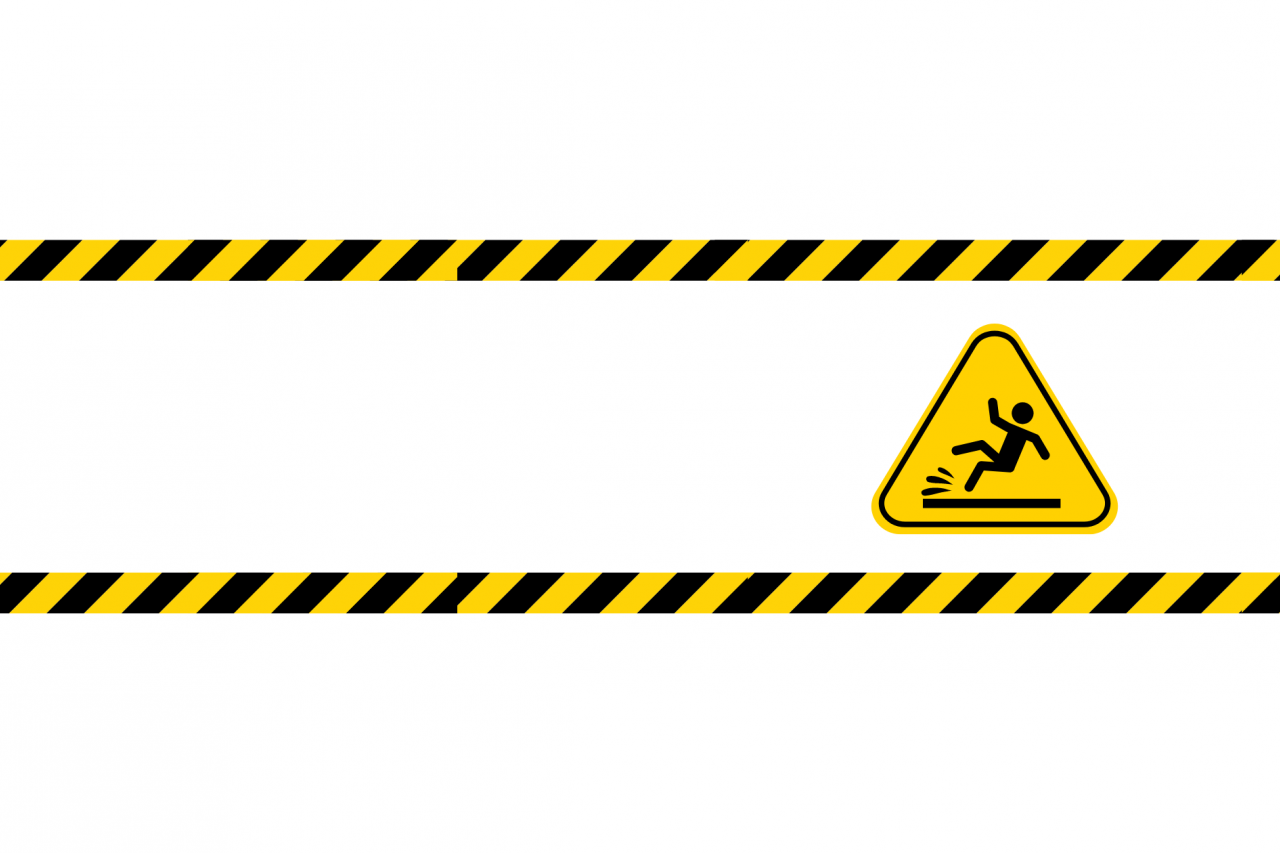 Slip and fall hazard sign with yellow caution tape borders