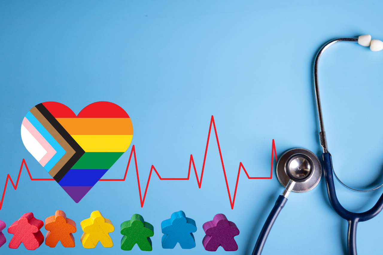 A heart-shaped LGBTQ+ Pride Flag along an electrocardiogram pulse line leading to a stethoscope, while a line of people shapes in a range of rainbow colors stands underneath the heart.