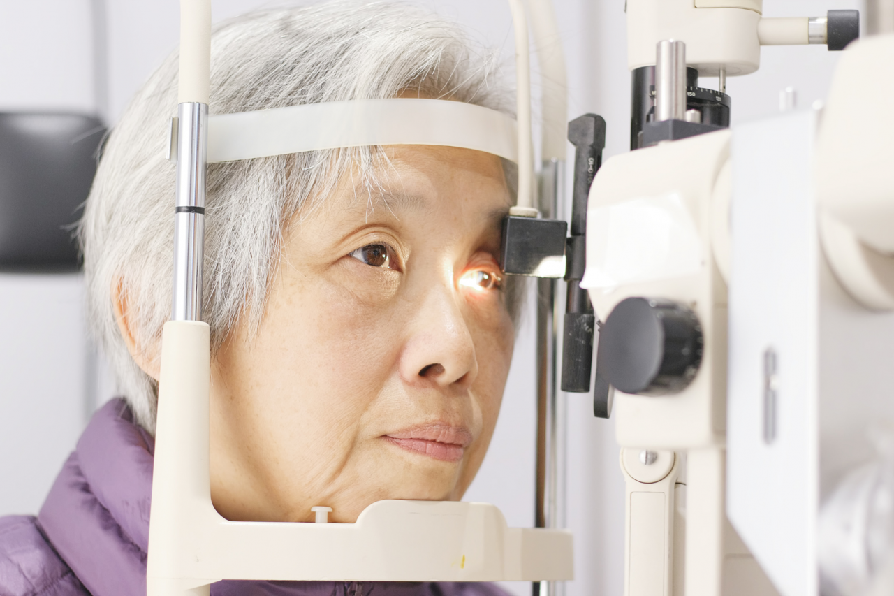 Older Asian woman having her eyes examined