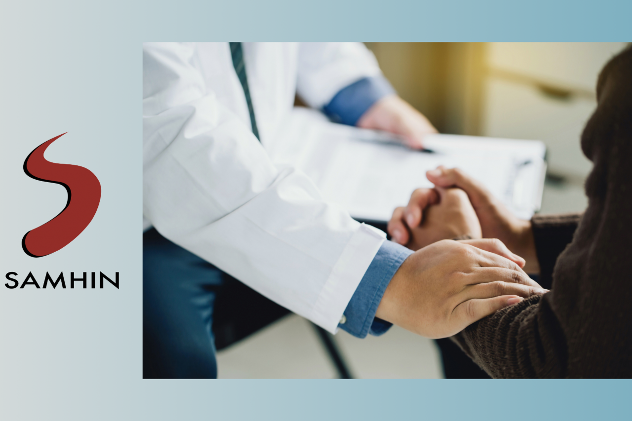 zoom in photo of a psychiatrist comforting a patient