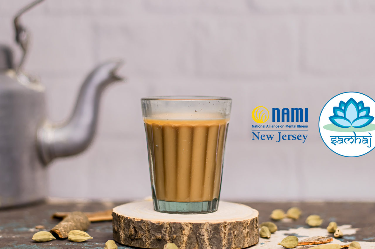 Picture of a kitchen countertop with Indian chai in glass cup on top of a wooden coaster in the foreground, a metal kettle and other masalas to make tea in the background, and the NAMI NJ and SAMHAJ logos superimposed on the right side of the picture.