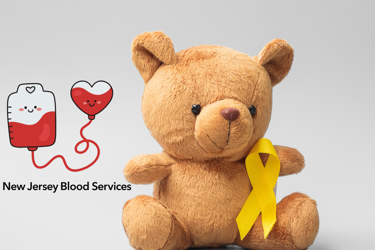 Image of stuffed bear toy with a golden yellow ribbon for Childhood Cancer Awareness Month on it. On the left there is a vector illustration of a blood bag connected to a heart shape filled with blood with smiley faces on both, and below that is the New Jersey Blood Services logo.