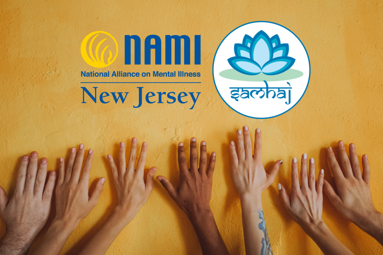many hands of different shades of brown on a golden yellow painted stone wall with the NAMI NJ logo and SAMHAJ logo