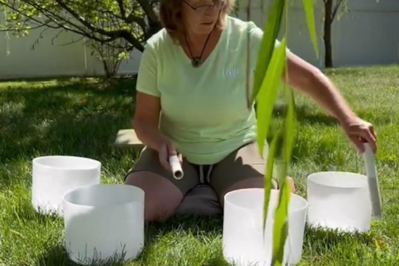 Picture of woman using reiki bowls
