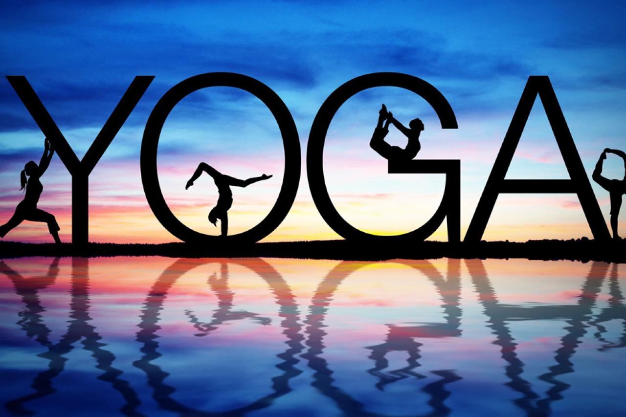 Illustration of silhouettes of people doing yoga poses alongside the word “yoga” in a nature setting