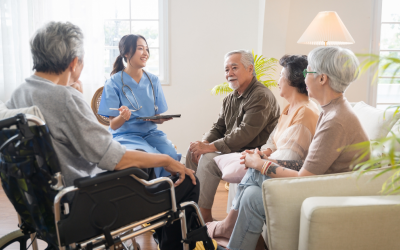 Patients talking with a healthcare worker holding a clipboard