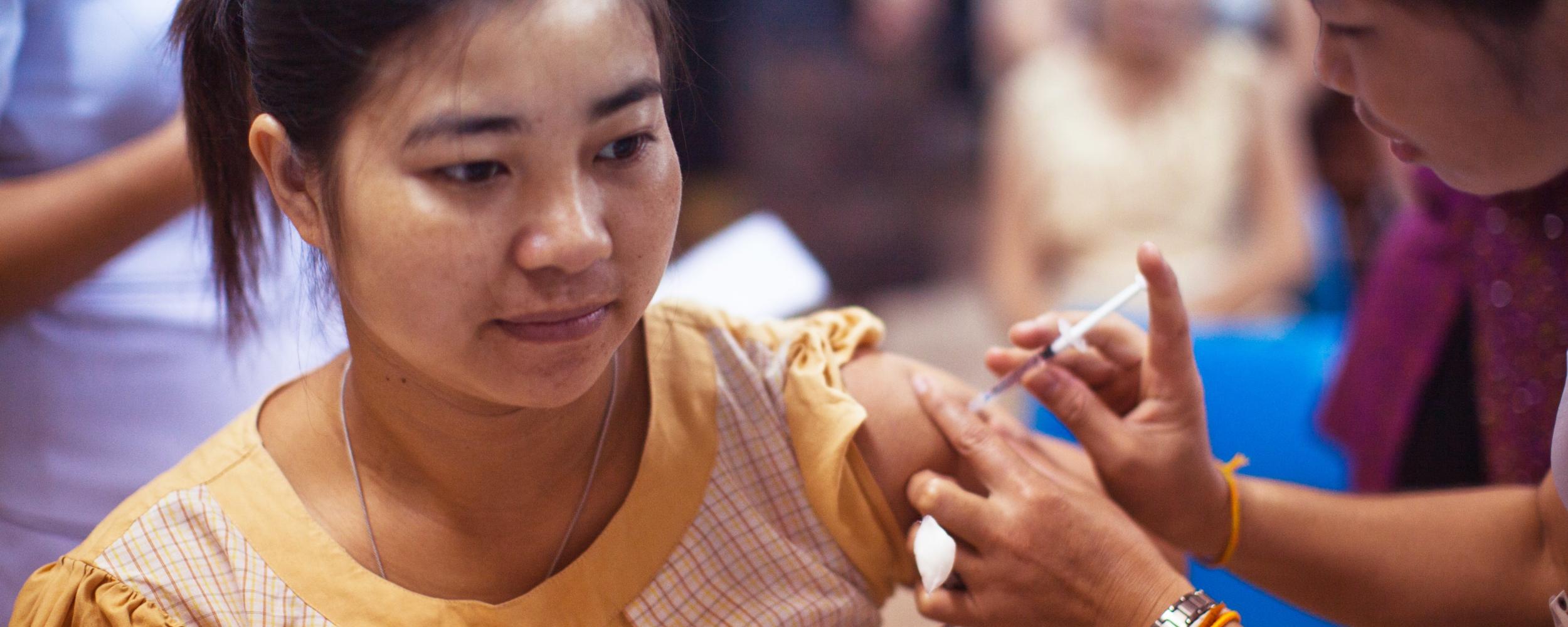 Teen receiving injection of COVID-19 Vaccine. Photo by CDC on Unsplash