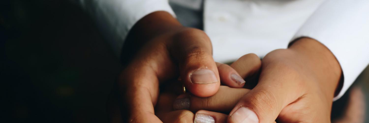 doctor holding patient's hand