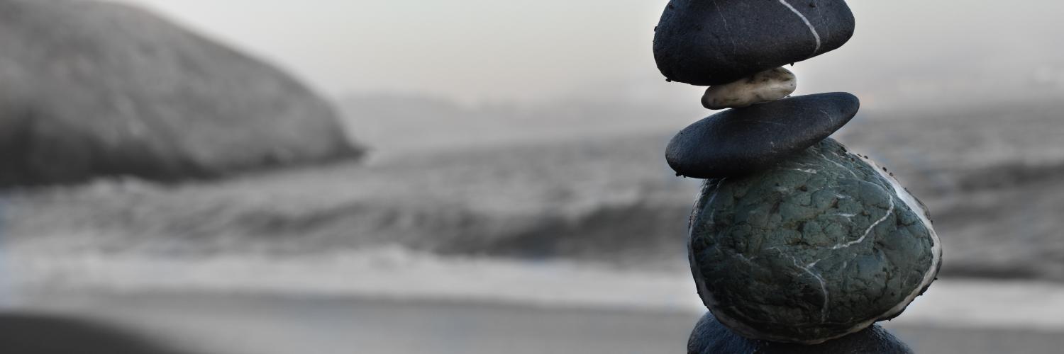 a seascape with the focus on a small pile of rocks