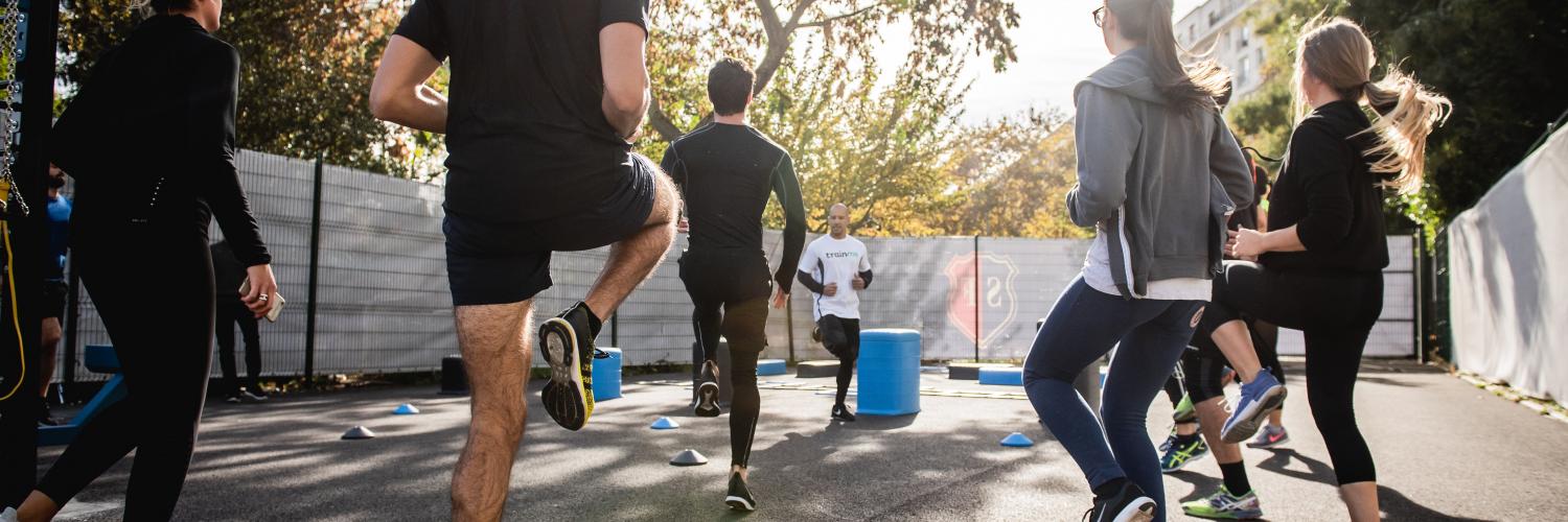 a group of people wearing black jog in place