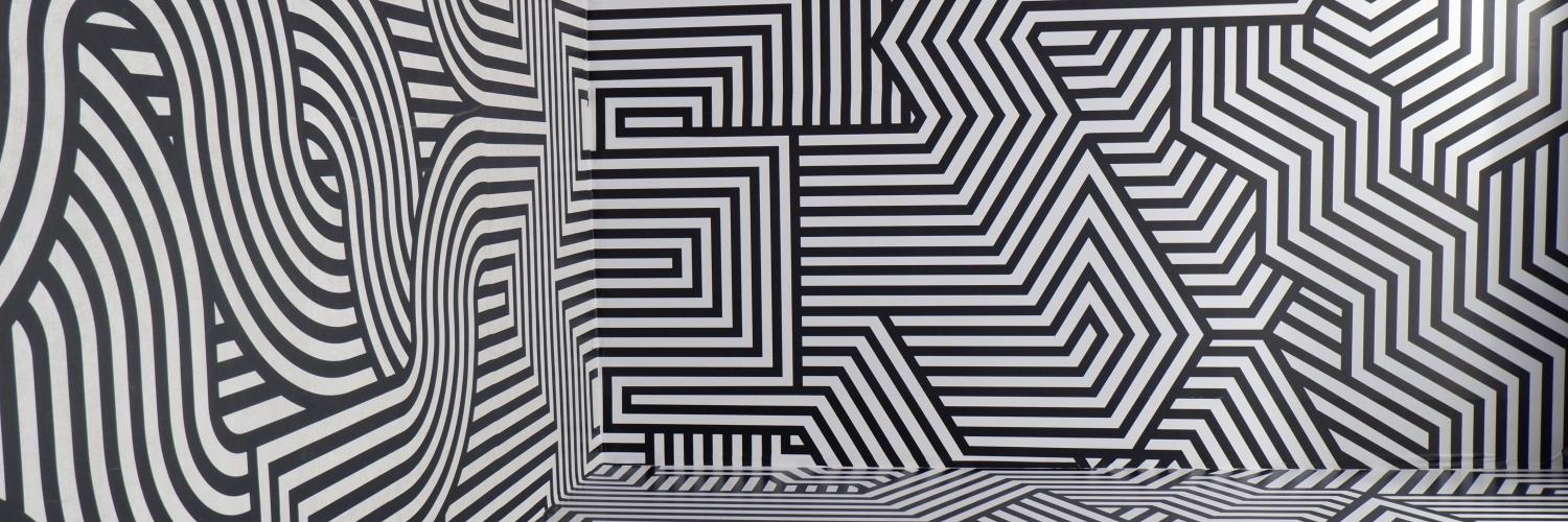 a room covered in zigzag and swirly patterns