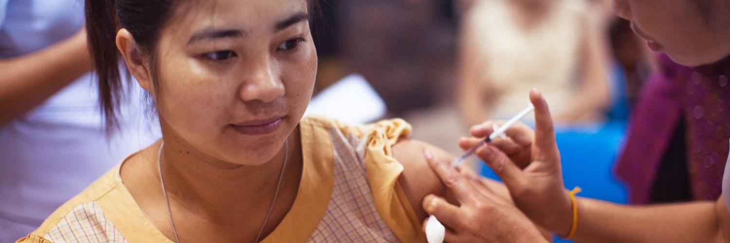 Teen receiving injection of COVID-19 Vaccine. Photo by CDC on Unsplash