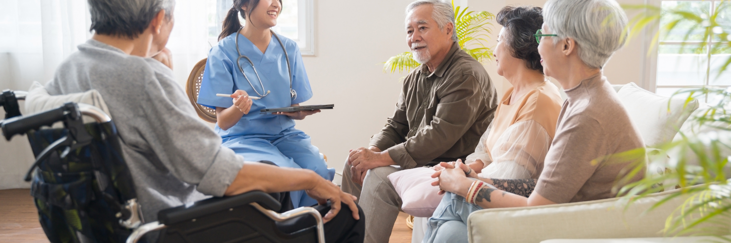 Patients talking with a healthcare worker holding a clipboard