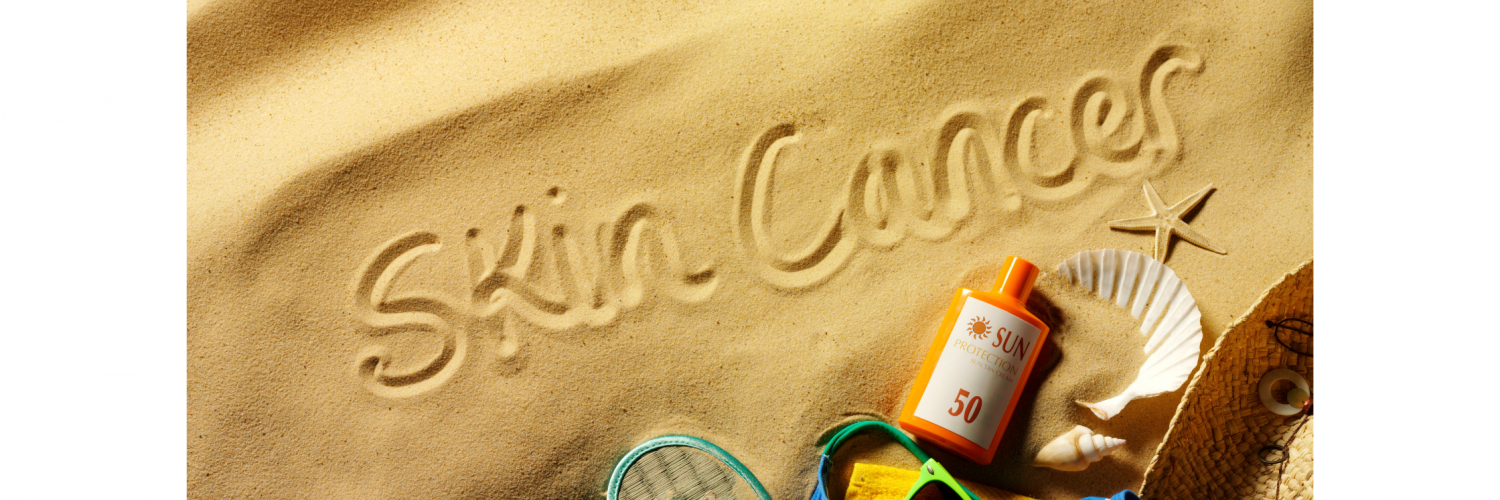 "skin cancer" written in the sand on the beach surrounded by sunblock lotion, sunglasses, flip flops, hat, bathing suit, and sea shells