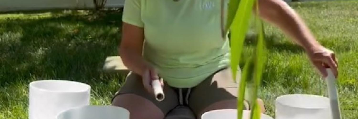 Picture of woman using reiki bowls